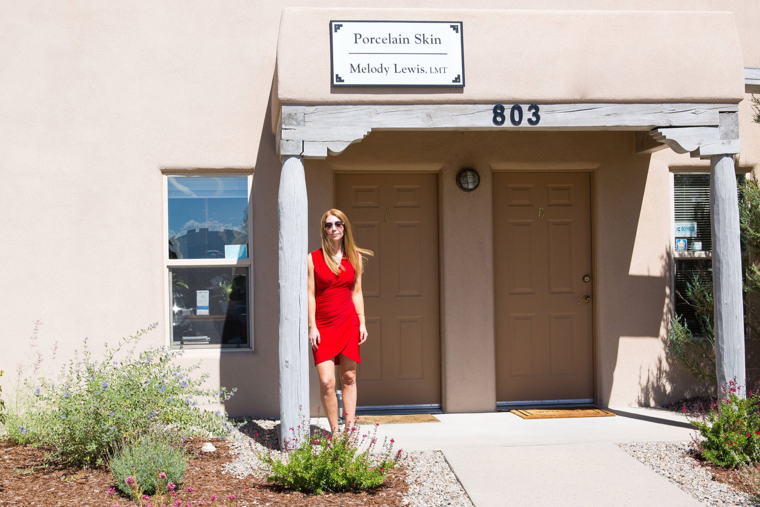 medical aesthetician sara blessing in front of her porcelain skin office in santa fe new mexico